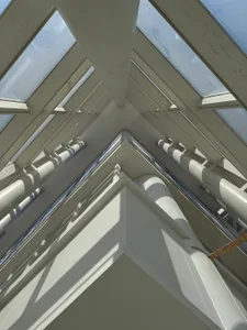 An image of a glass ceiling with modern architectural design