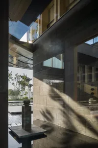 A modern building exterior featuring concrete materials and architectural details.
