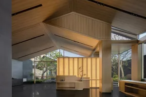 Modern lobby with wooden finishes and large windows