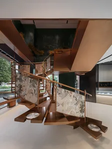 Modern metal staircase with dynamic, organic patterns in a contemporary architectural setting.