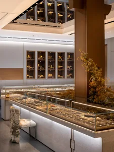 Retail jewelry shop featuring glass walls displaying jewelry and accessories.
