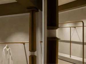 Clothing rack with metal rods in an interior setting