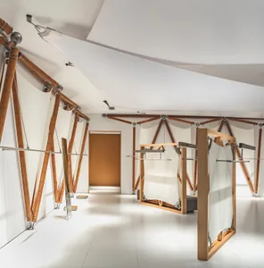 Interior design featuring a minimalist fashion design store with wooden structural elements.