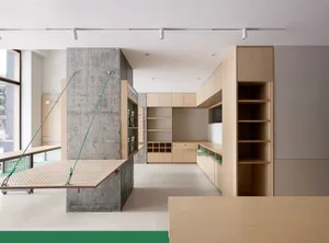 Modern minimalist office space featuring concrete and wood elements.