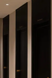 Black fitting room door in a modern fashion retail environment