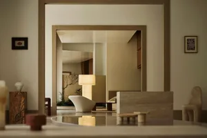 Modern living room with neutral-toned furnishings and minimalist decor.