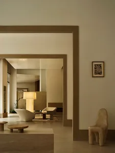 Modern living room with minimalist furniture and concrete and stone materials