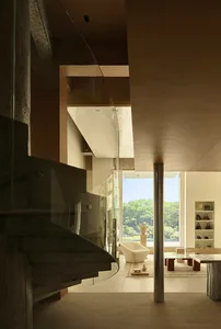 A modern residential interior featuring concrete materials and contemporary design elements.