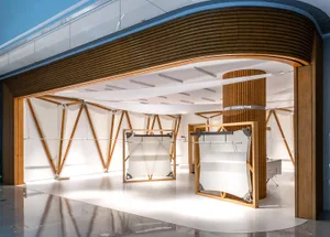 A modern retail storefront featuring a wooden structure with geometric shapes and hanging white panels.