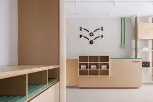 Modern spa interior featuring wooden furniture and white walls.