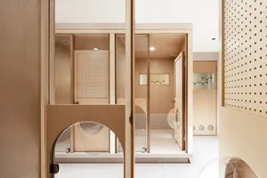 Minimalist bathroom featuring wood elements and modern fixtures.