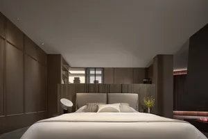 Minimalist bedroom featuring a headboard with a neutral color palette and simple design.