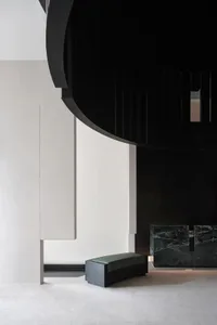 Modern minimalist lobby with concrete walls and marble accents