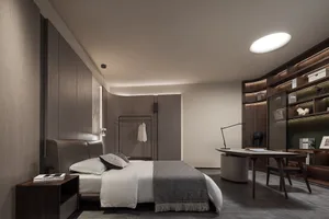 A modern bedroom featuring wooden walls and a bed with white bedding.
