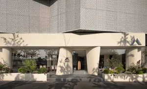 A modern storefront with glass and stone materials.