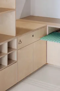 Modern minimalist furniture with clean lines and a natural wood finish.
