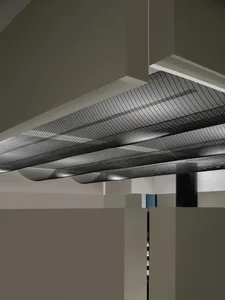 A modern interior design featuring a minimalist metal grid ceiling fixture.