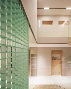 A modern interior with a glass wall and minimalist design.