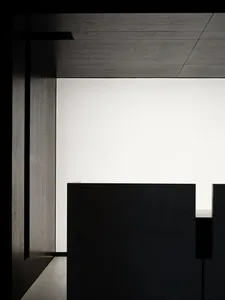 A minimalist interior with concrete walls and floor, featuring a sleek, contemporary design.