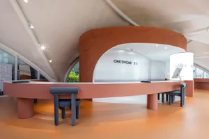 A modern retail storefront featuring a sleek concrete design.