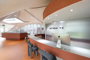 A modern retail storefront with white walls and a sleek design.