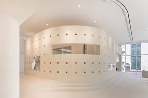White interior space featuring brick tiles and concrete, minimalist design