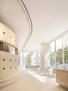 Modern, minimalist commercial interior with large windows showcasing a sleek, contemporary design.