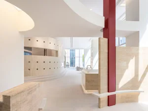 Modern commercial space featuring concrete, metal, and glass materials.