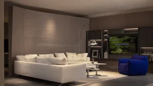 Modern living room with white fabric sofa and blue knitted chairs, wooden cabinets, and a flat-screen TV.