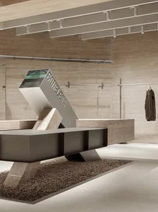 Modern industrial retail space featuring metal, concrete, and glass elements