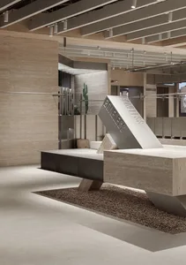 Modern retail store interior featuring exposed concrete walls, minimalist design, and industrial elements.