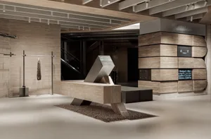 A modern retail space featuring a concrete interior design with minimalist architectural elements.