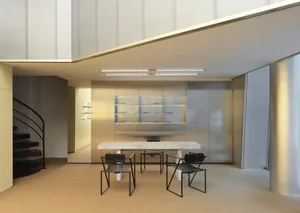 Modern interior of a glasses shop featuring minimalist metal design and metal shelves.