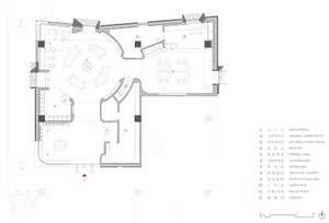 A floor plan of a modern office layout in black and white design, showing various functional zones and spatial composition.