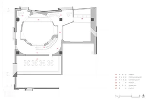 Floor plan of a modern office space with open areas and functional zones.