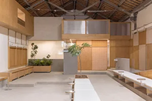 Industrial-style coffee shop with concrete floors and wooden elements