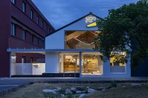 Modern storefront with glass, concrete, and wood materials