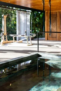 An elegant minimalist spa facility featuring wooden elements and a serene environment.