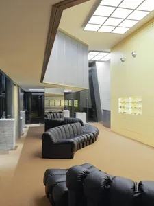 A modern retail store with neutral colors and concrete elements.