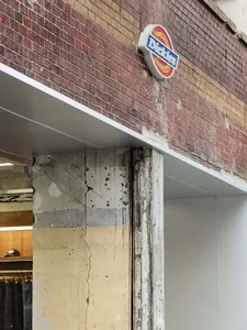 Brick and concrete storefront with Dickies logo
