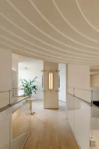 An image of a modern living space with a wooden floor, showcasing integrated design features.