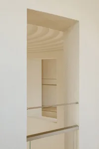 Modern minimalist interior space featuring glass elements