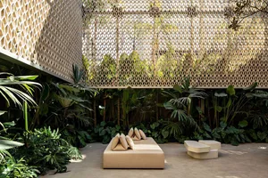 Modern industrial rooftop garden with concrete plants and wooden lattice