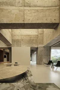 A modern interior space with concrete walls and floors.