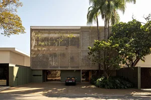 Modern house exterior showcasing metallic screen panels