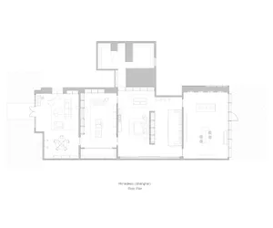 一張極簡風格的住宅平面圖，融合混凝土、玻璃與木質元素。