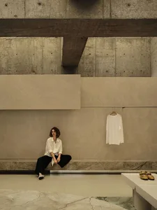 A modern retail storefront featuring minimalist concrete architecture and industrial style.