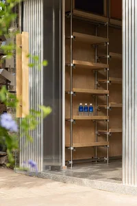 A modern shop with a metal frame and glass walls.