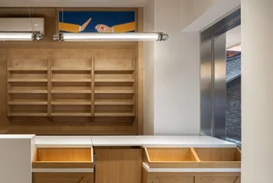 A modern commercial space featuring wooden furniture, showcasing sleek, minimalist design with natural wood textures.