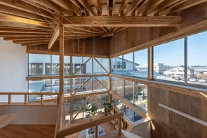 Modern office space featuring live-edge wood accents and large windows.